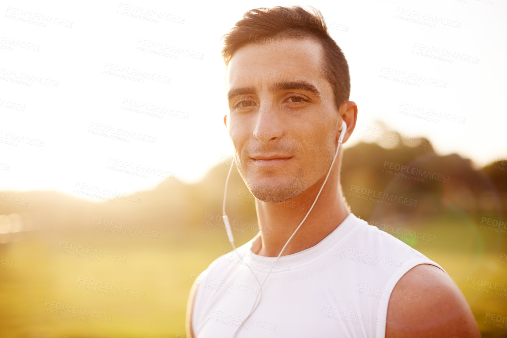 Buy stock photo Earphones, fitness and portrait of man in park for runner podcast, workout and live streaming. Wellness audiobook, training and health with person in nature for marathon practice, music and cardio