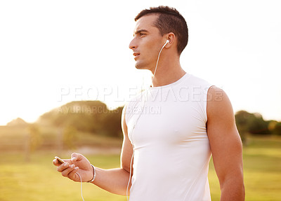 Buy stock photo Fitness, earphones and man in nature for cardio exercise with endurance, speed and race training. Serious, sports and male athlete with audio tech for music or podcast with outdoor running workout.