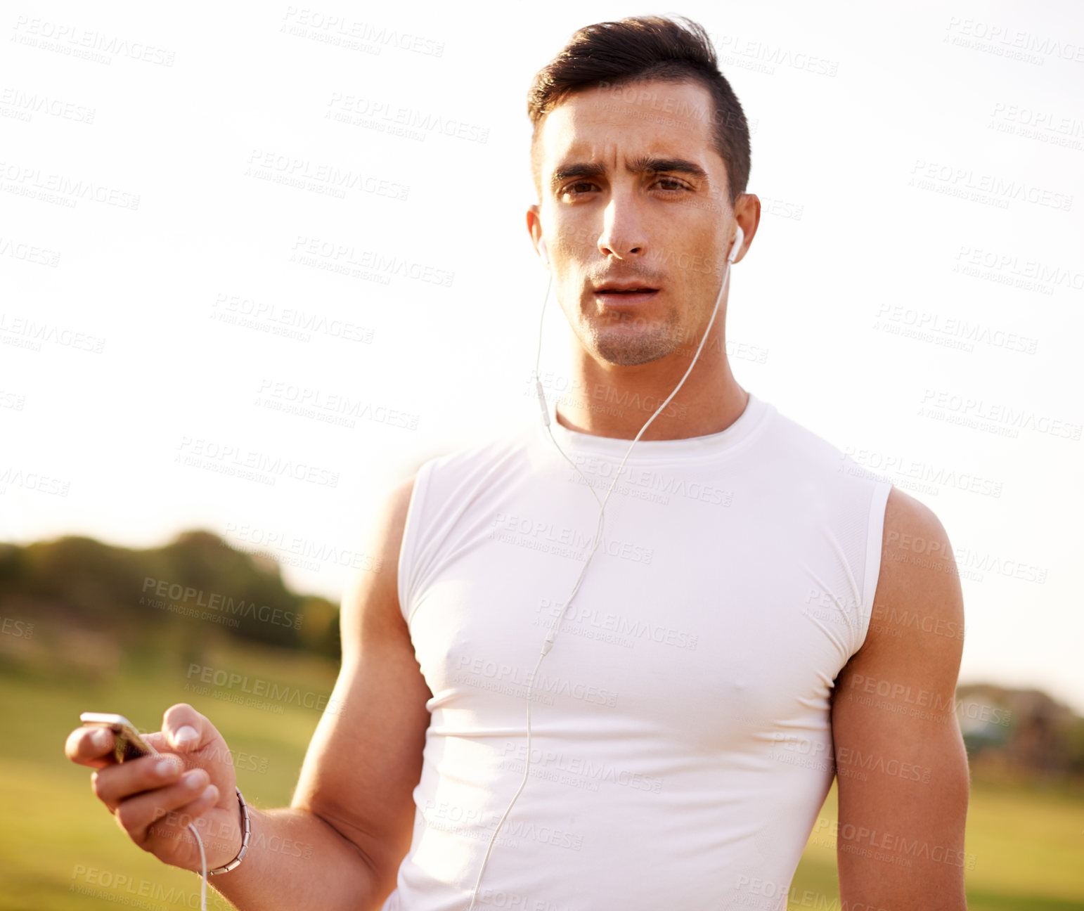 Buy stock photo Fitness, earphones and portrait of man in nature for running exercise with endurance, speed and race training. Serious, sports and male athlete with audio tech for music with outdoor cardio workout.