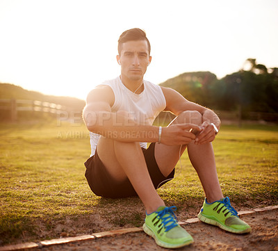 Buy stock photo Fitness, man and portrait with earphones at park for music, audio streaming and listening to radio after workout. Athlete, person or online subscription for podcast, exercise break and relax on grass