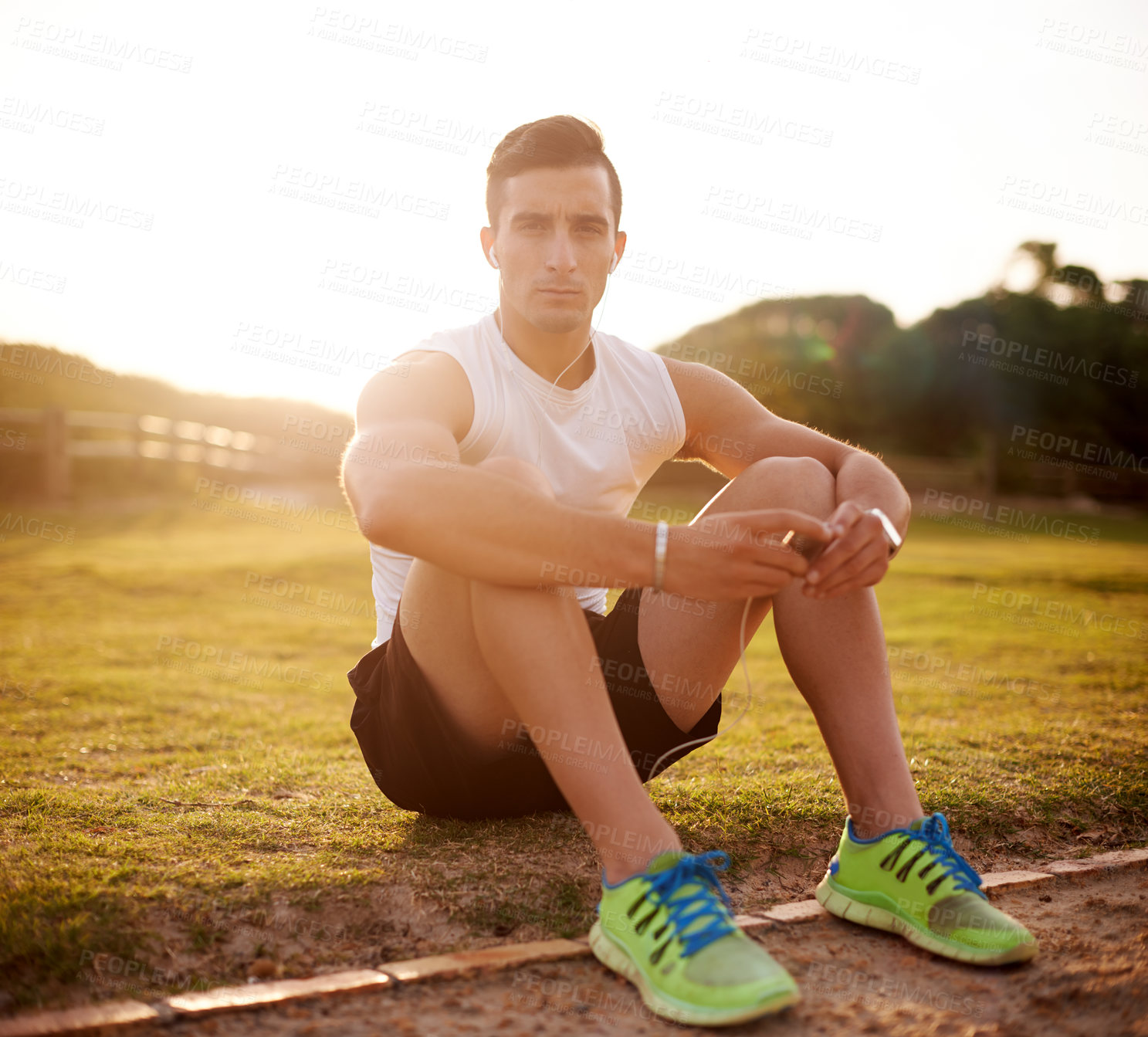 Buy stock photo Fitness, man and portrait with earphones at park for music, audio streaming and listening to radio after workout. Athlete, person or online subscription for podcast, exercise break and relax on grass