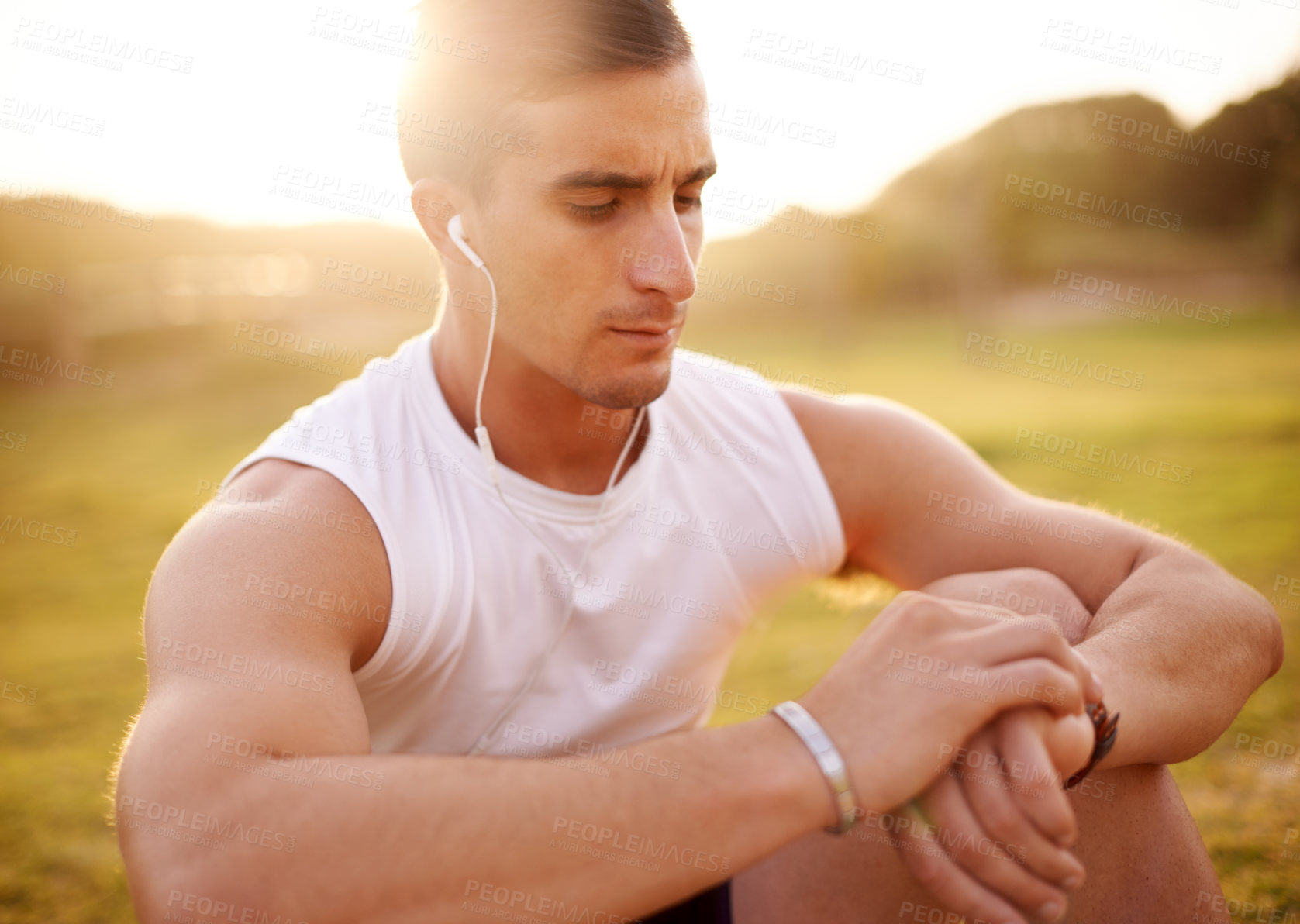 Buy stock photo Smart watch, earphones and man in nature for running with fitness tracker app for heart rate. Sports, audio tech and male athlete with digital wristband for cardio activity monitoring with workout