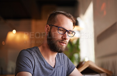 Buy stock photo Serious, thinking and man with glasses, cafe and waiting for order, calm and relax on break in store. Contemplating, customer and thoughtful for menu in coffee shop, lunch and person with eyewear