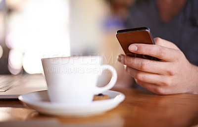 Buy stock photo Hand, phone and person in cafe on internet, typing text or 5 star review closeup. Coffee shop table, mobile or chat notification, communication or influencer post drink on social media profile online