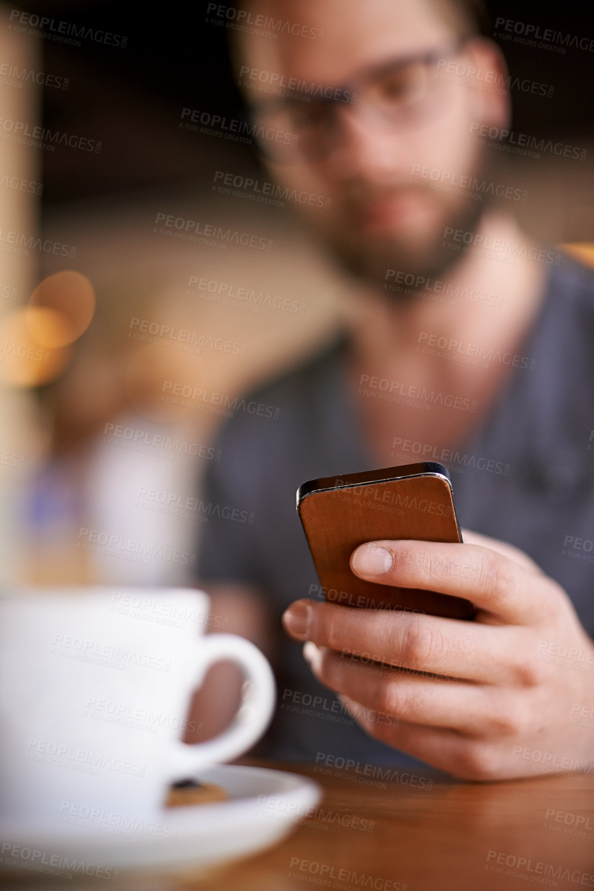 Buy stock photo Hand, phone and man in coffee shop on internet, typing text or 5 star review closeup. Cafe table, mobile and chat notification, communication or influencer post drink on social media profile online