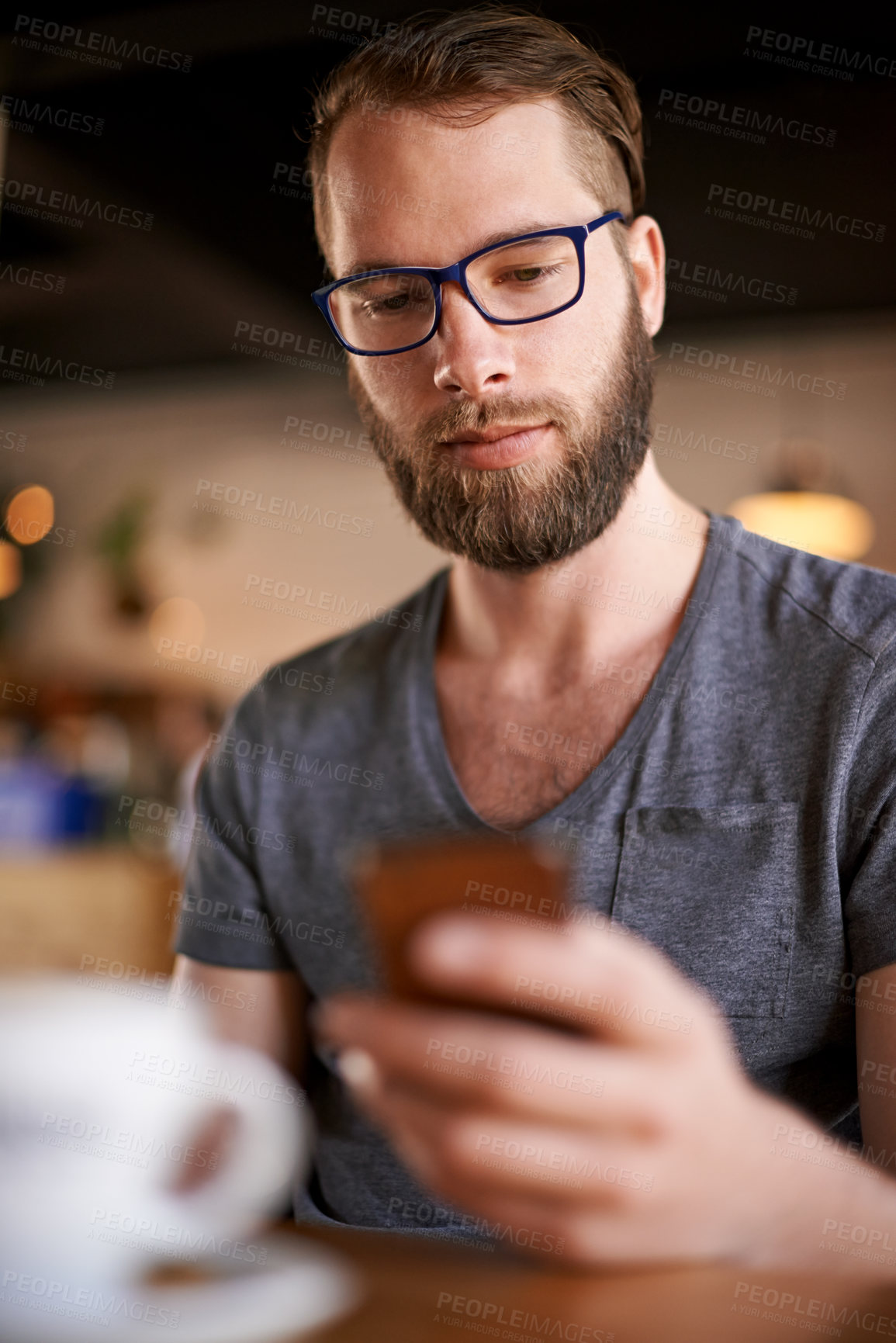 Buy stock photo Man, phone and reading text in coffee shop for project, networking and internet website research for inspiration. Cafe, app and freelance editor with email for remote work, communication or planning