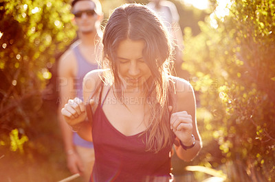 Buy stock photo Adventure, backpacking or hiking and woman in mountain with friends for exploration, journey or travel. Exercise, fitness and health with group of people walking outdoor in nature for summer bonding