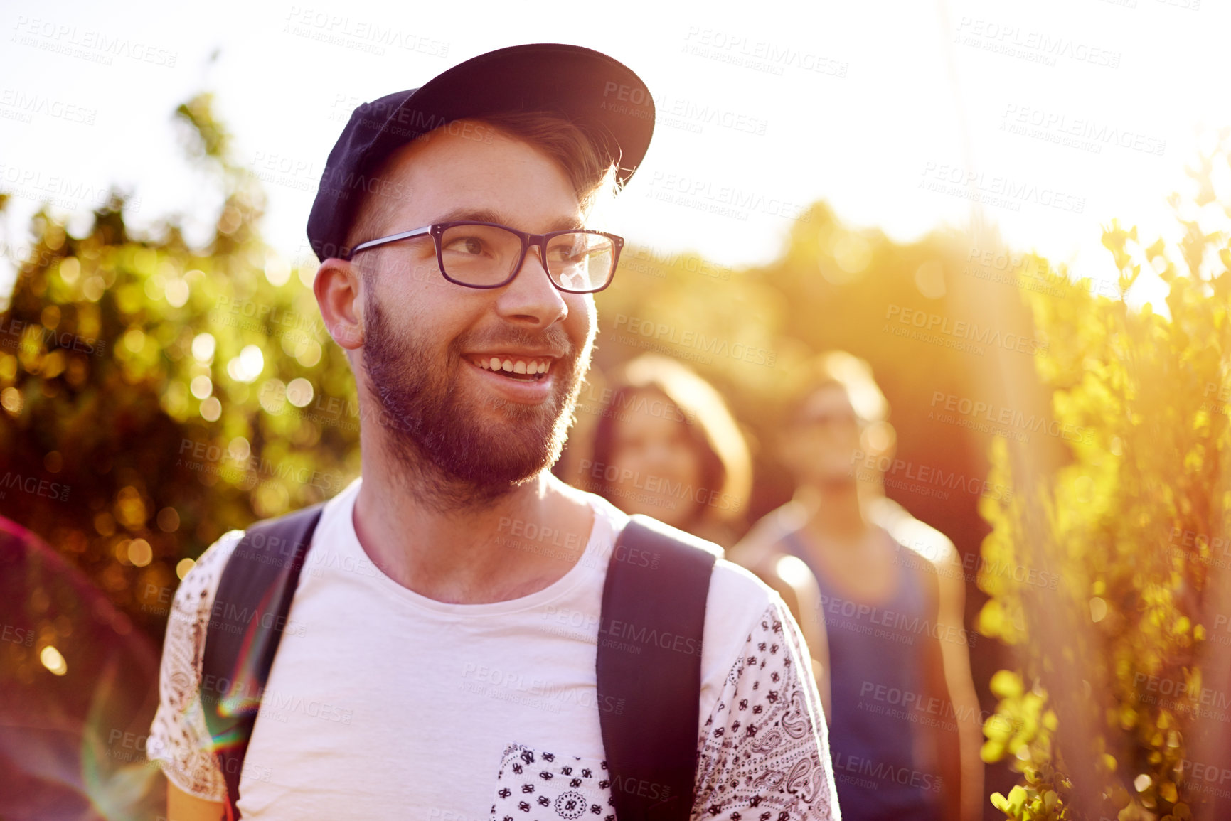 Buy stock photo Hiking, smile or thinking with man and friends in mountains for bonding, exploration or journey. Exercise, fitness and health with happy group of people walking outdoor in nature for summer travel