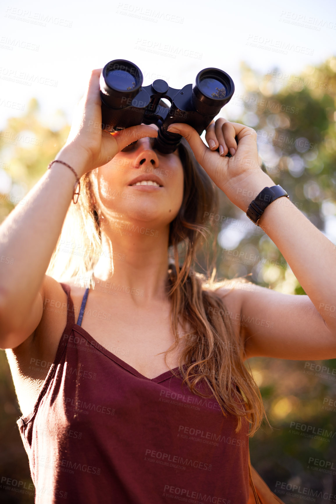 Buy stock photo Travel, trekking and woman with binocular in nature for adventure, holiday or bird watching in woods. Smile, lens and hiking outdoor for vacation, below sightseeing or forest view for search 