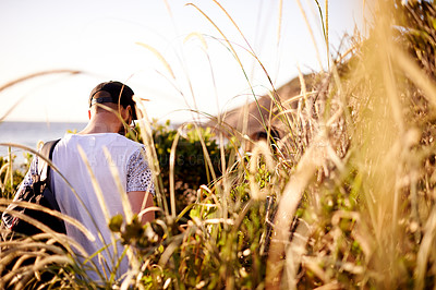 Buy stock photo Back, man and walking or hiking on mountains with bush adventure, travel journey and exploration. Person, backpacking and trekking in nature, fitness getaway and vacation trip with destination path