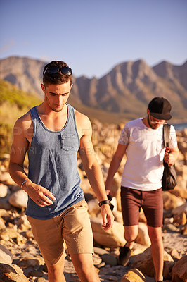 Buy stock photo Men, friends and walking at beach outdoor for summer vacation, weekend break and getaway. People, travel and ocean trip for holiday destination, island location and tropical adventure of calm morning