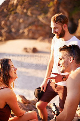 Buy stock photo Relax, smile and talking with friends at beach for summer vacation, adventure and tropical destination. Holiday, travel and tourism with people on hill outdoors for wellness, sunset and paradise