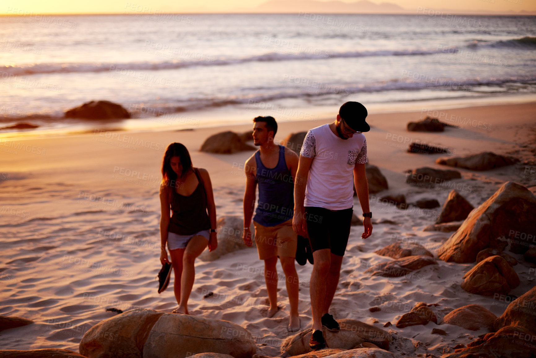 Buy stock photo People, sunset and walk at ocean for travel, summer holiday and journey at day end. Friends, students bonding and vacation in Australia for adventure, outdoor trip and peaceful study break at beach