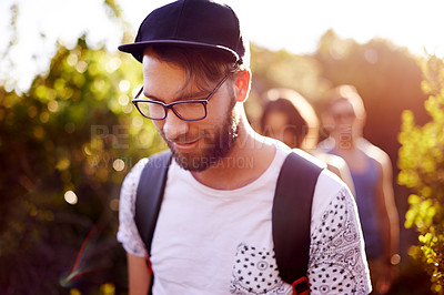 Buy stock photo Exercise, hiking or walking and man in mountains with friends for bonding, exploration or journey. Fitness, health and wellness with group of backpacker people outdoor in nature for summer trekking