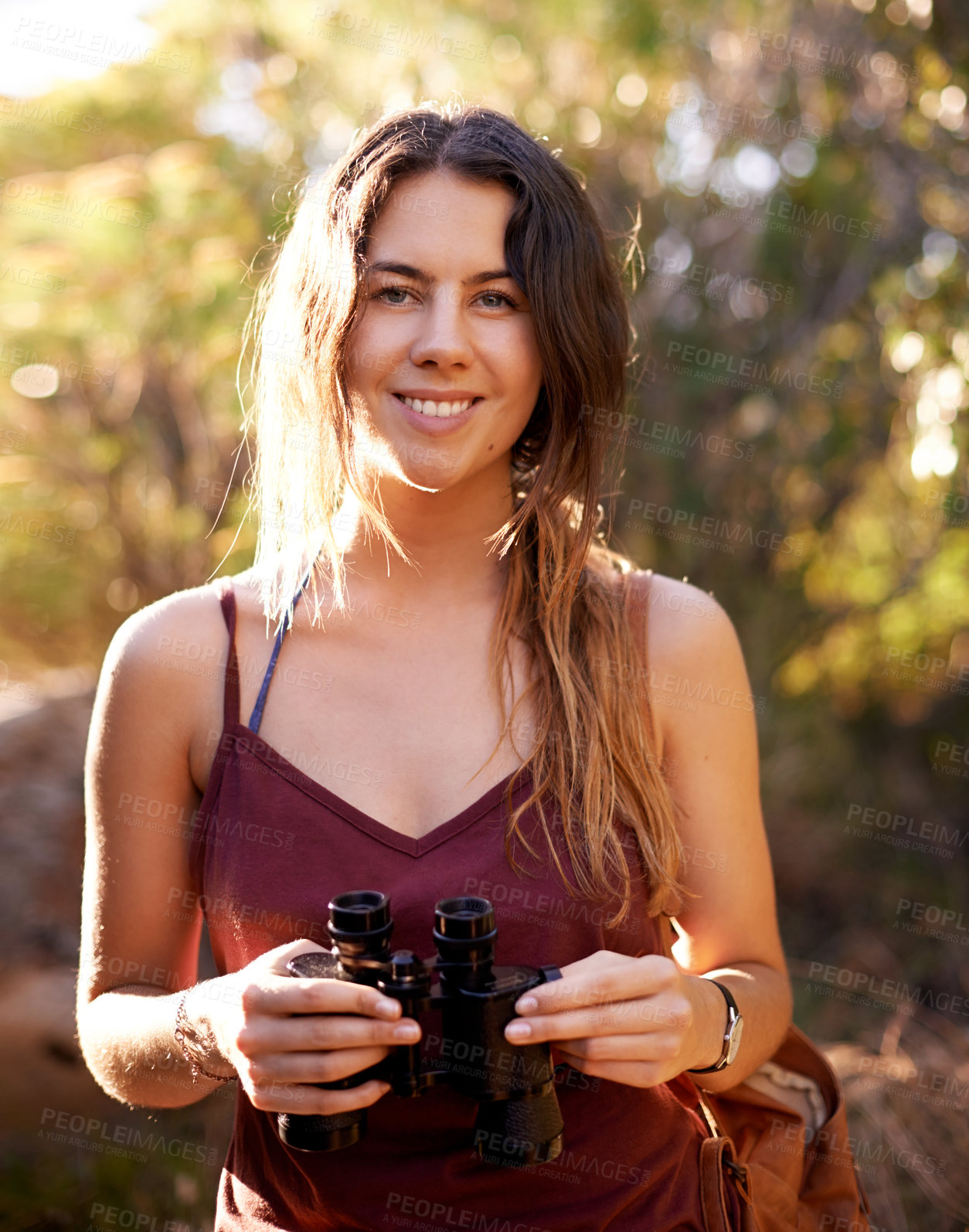 Buy stock photo Portrait, trekking and happy woman with binocular in nature for adventure, holiday or bird watching in woods. Face, tourism and hiking outdoor for vacation, sightseeing or search in forest in Germany