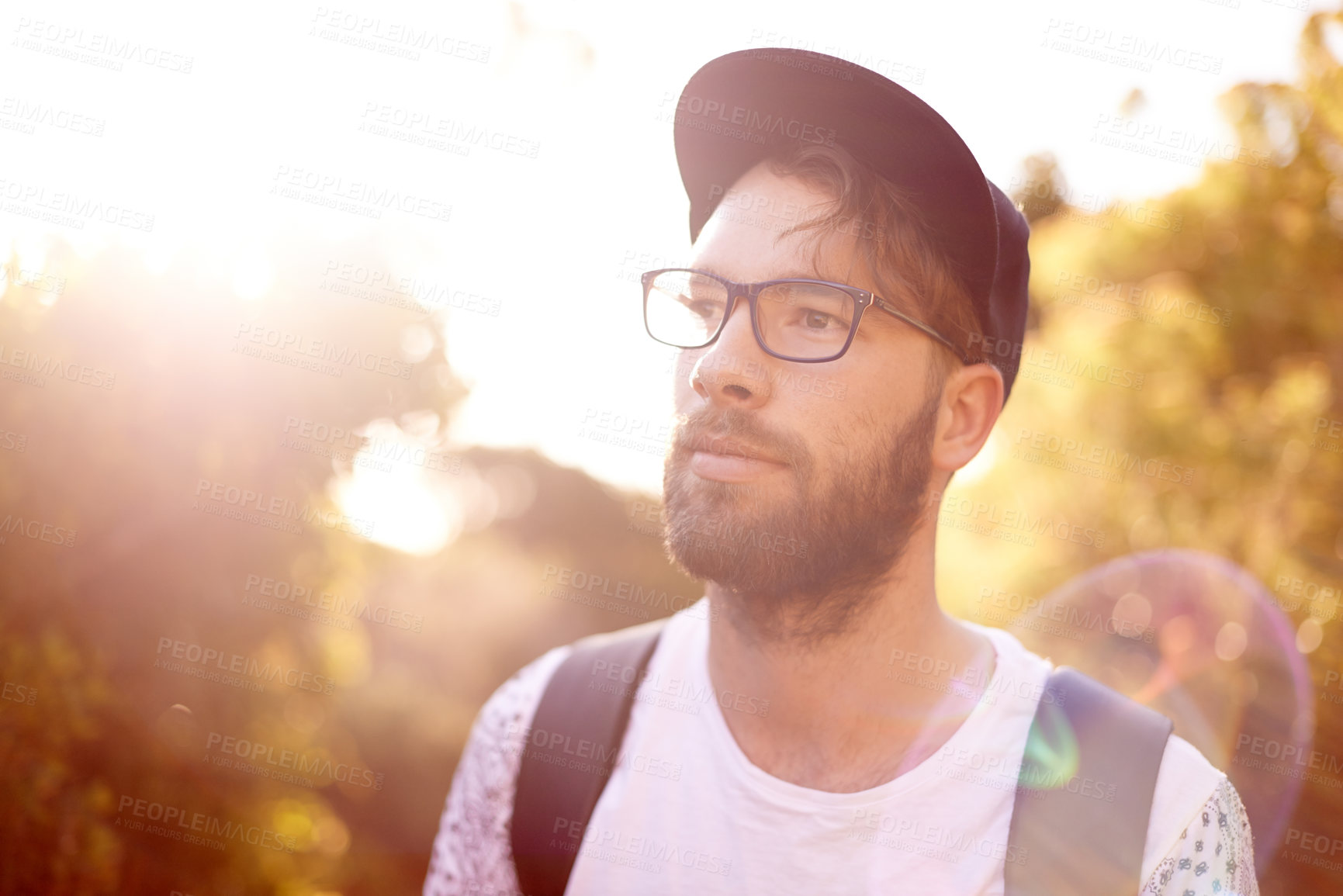 Buy stock photo Man, thinking and hiking in nature, fitness and outdoor travel for cardiovascular wellness. Holiday expedition, tourist and walking in forest, trekking and journey for reflection with lens flare