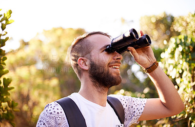 Buy stock photo Travel, hiking and happy man with binocular outdoor for adventure, holiday or bird watching in woods. Lens, tourism or trekking in nature for vacation, sightseeing or search for ornithology with view