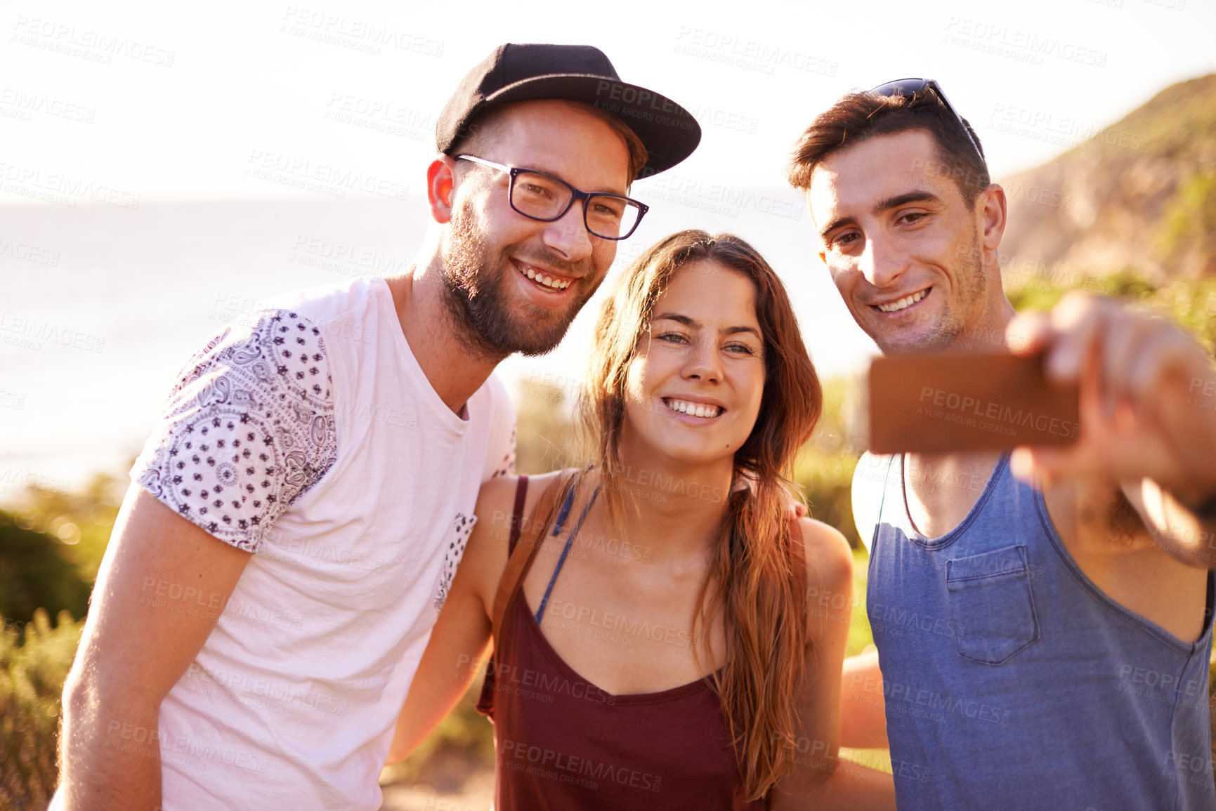 Buy stock photo Friends, selfie and sunset walk on mountain for countryside, travel or adventure to explore nature. Journey, group of people and memories with natural environment for hiker, hobby or bonding together