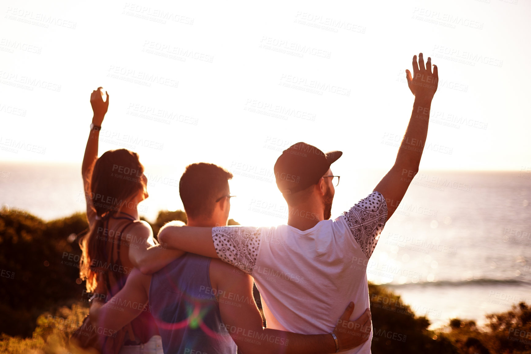 Buy stock photo Celebration, beach and friends on holiday, view and waving for reunion in paradise, back and outdoor. Space, people and embrace for relationship in nature, scenery and location for vacation in Greece