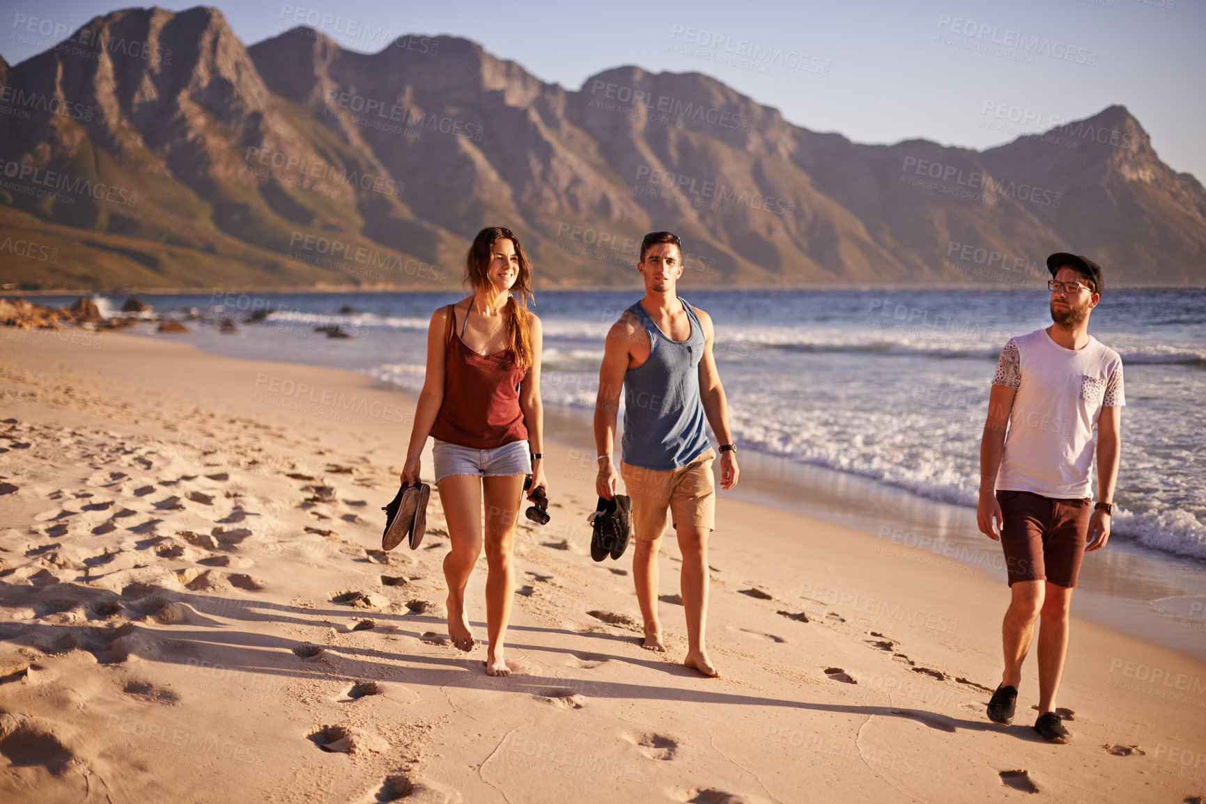 Buy stock photo Happy, people and walking on beach outdoor with travel reunion, summer adventure and getaway. Smile, friends and ocean trip with holiday journey, island destination and bonding together for gathering