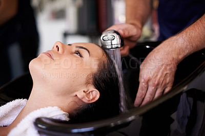 Buy stock photo Woman, hairdresser and shower in salon with water, basin and cleaning for hygiene, routine and wellness. People, service and washing for hair care with helping hand for cosmetics, change and growth