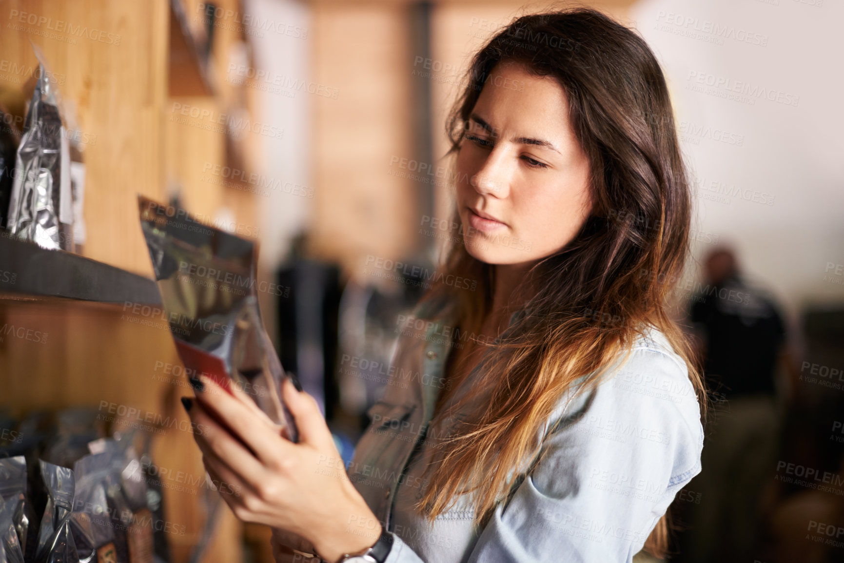 Buy stock photo Shopping, woman and coffee beans in package at store for product inspection, reading label info and sales decision. Customer, caffeine granules and checking quality for budget, ingredients and price