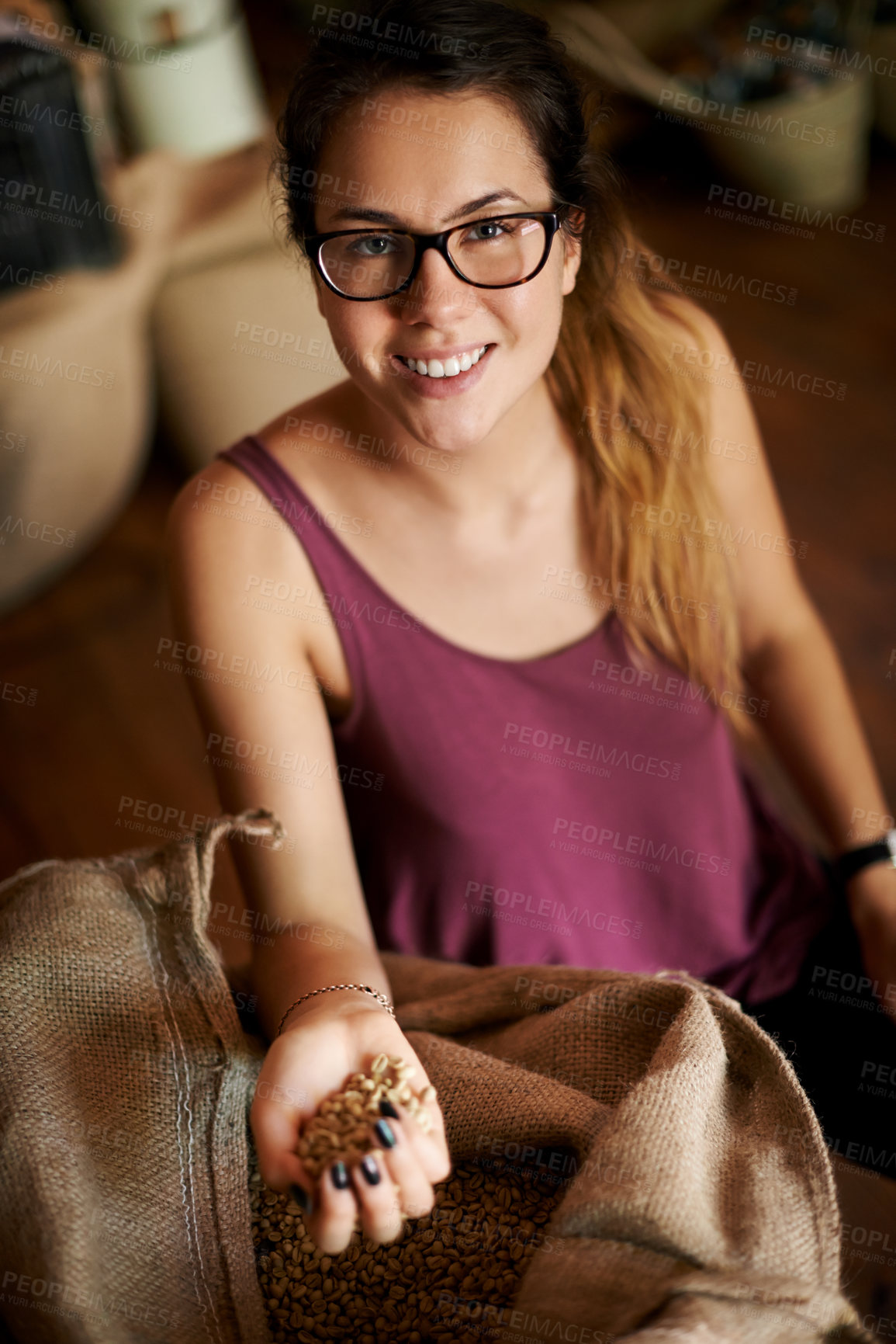 Buy stock photo Factory, portrait and woman with coffee beans, smile and inspection of bag for harvest and manufacturing. Production, above and barista with grains for caffeine, quality assurance and process