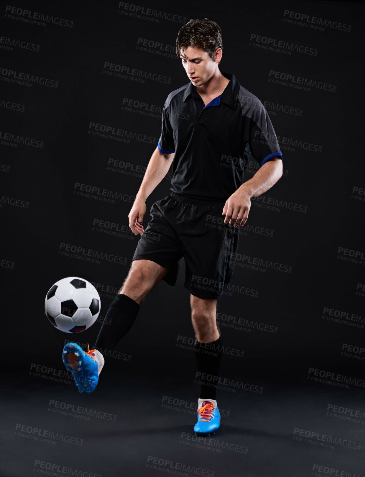 Buy stock photo Studio, fitness and man with football for sports training with exercise isolated on black background. Technique, talent and juggling trick for freestyle in Brazil with practice for control with skill
