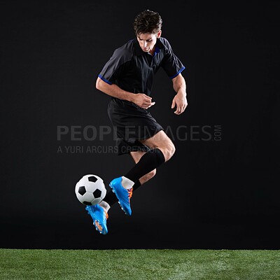 Buy stock photo Field, soccer player and man with jump for game, training and action for practice with ball. Black background, athlete and person with kick for football, talent and fitness for sport outdoor and goal