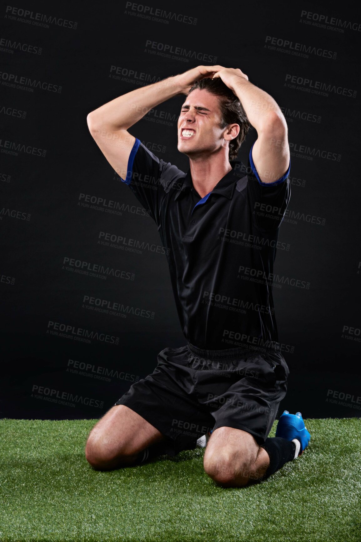 Buy stock photo Field, soccer player and man in grass, frustrated and fail in game, stress and upset on ground and outdoor. Black background, sad and athlete with hands, unhappy or  shouting of person and football