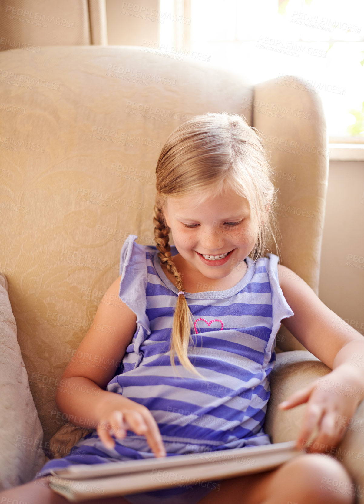 Buy stock photo Tablet, relax and kid on sofa in home playing educational online game for learning on weekend break. Happy, website and girl child on digital technology watching movie on streaming app in living room