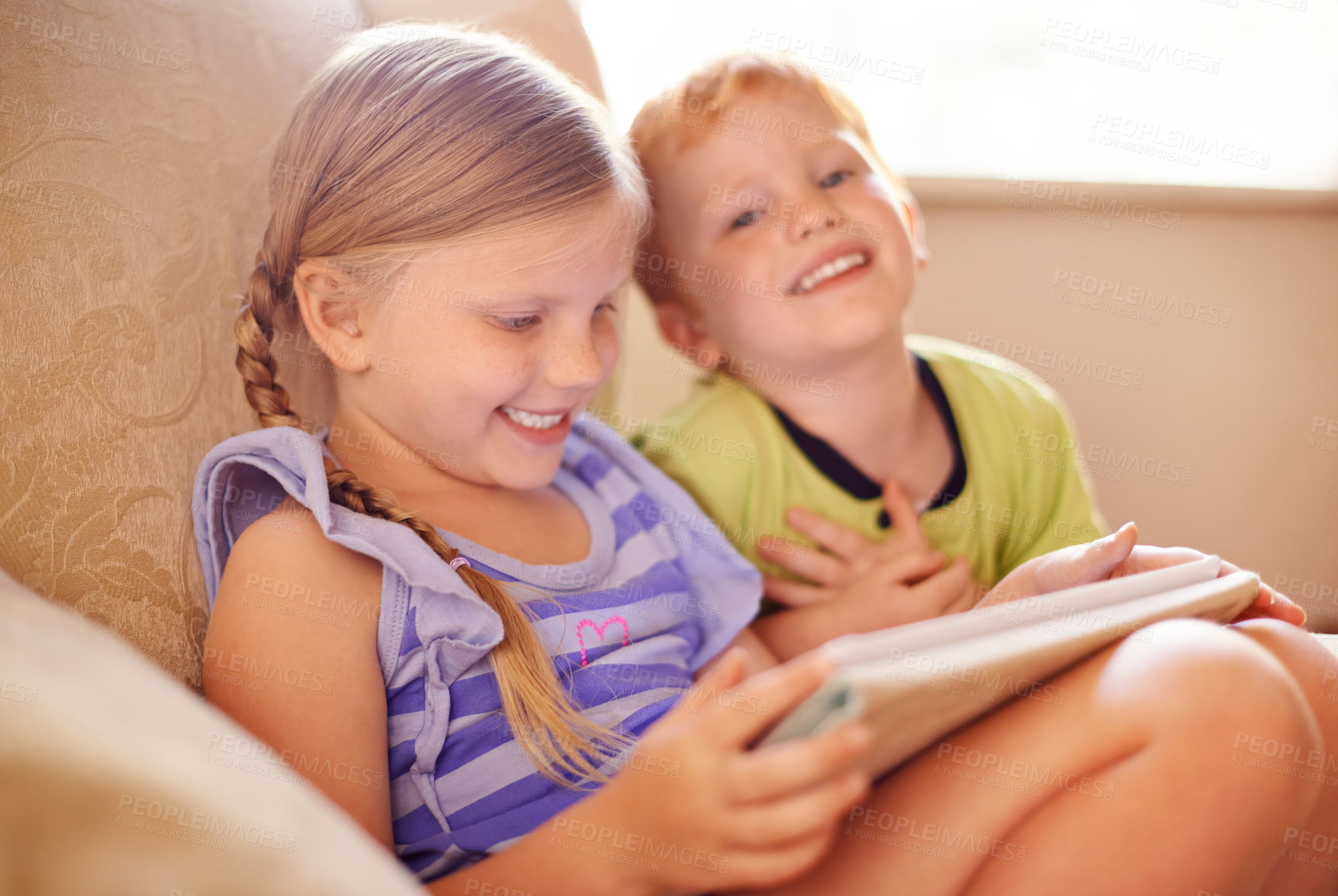 Buy stock photo Bonding, family and children with tablet, couch and smile for conversation in home, love or siblings. House, brother and online with sister in lounge, boy and girl with tech for movies or streaming