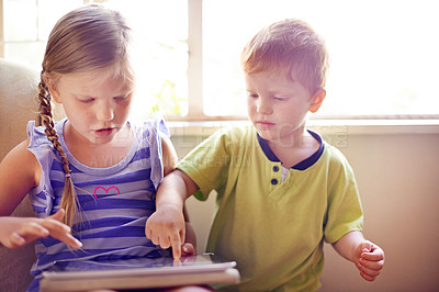 Buy stock photo Children, play and tablet on sofa at house for streaming movies, elearning and education website. Kids, relax and digital with online games, download film and bonding together for video entertainment