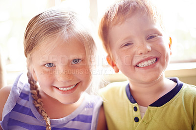 Buy stock photo Happy, relax and portrait of children on sofa for playing, bonding and sibling connection. Cute, sweet and face of kids chilling together in living room for school holiday or weekend break in house.