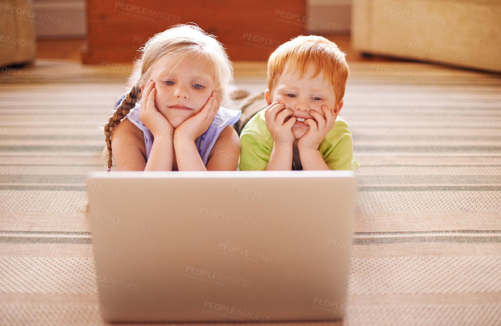 Buy stock photo Learning, siblings and children with laptop, floor and watching of educational videos, home and relax. House, sister and brother with knowledge in living room, growth and development for youth