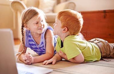 Buy stock photo Relax, family and children in living room, talking and smile for conversation in home, love and siblings. House, brother and chat with sister in lounge, happy and boy with girl on floor by laptop