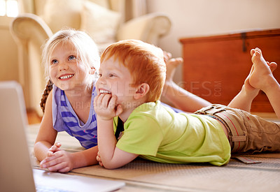 Buy stock photo Relax, siblings and children with laptop, happy and education with videos, learning and watching. House, sister and brother with knowledge in living room, growth or development for youth with info