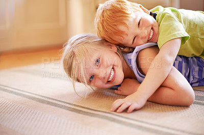 Buy stock photo Happiness, girl and boy playing with siblings in home for bonding, love and hug in childhood. Fun, games and portrait on living room floor for playful children with brother and sister in family house