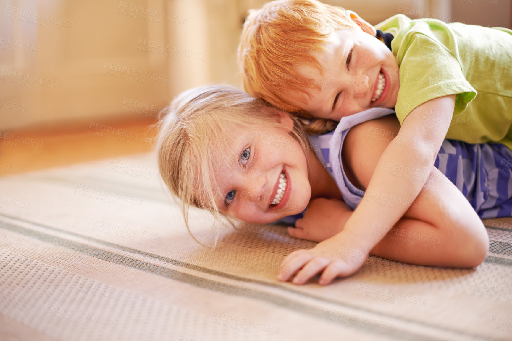 Buy stock photo Happiness, girl and boy playing with siblings in home for bonding, love and hug in childhood. Fun, games and portrait on living room floor for playful children with brother and sister in family house