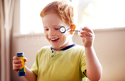 Buy stock photo House, blowing bubbles and boy with fun, excited and playful with joy, activity and child. Smile, apartment and kid with freedom, growth and youth development with break and happiness in living room