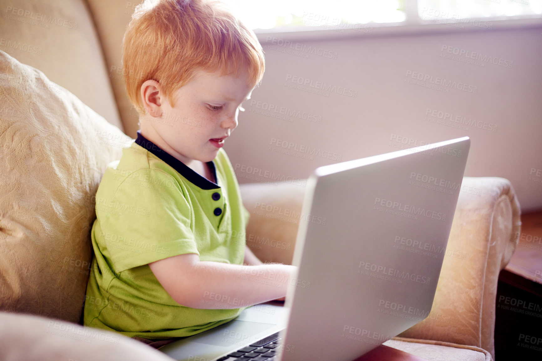 Buy stock photo Education, serious and child with laptop, home and elearning for boy in living room, growth and development. House, studying and knowledge for kid with assignment, online or tech for digital literacy