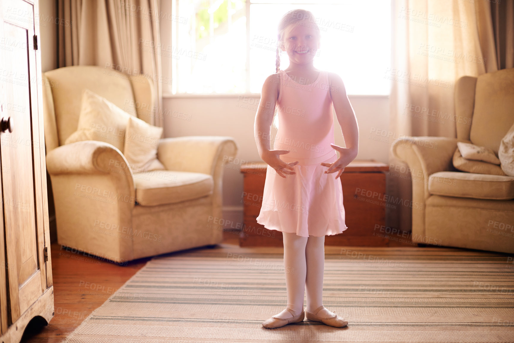 Buy stock photo Girl, portrait and ballet tutu for dance, confidence and skill in living room for growth or fun in home. Child, artist and smile with dancer, practice or development for creative in house lounge