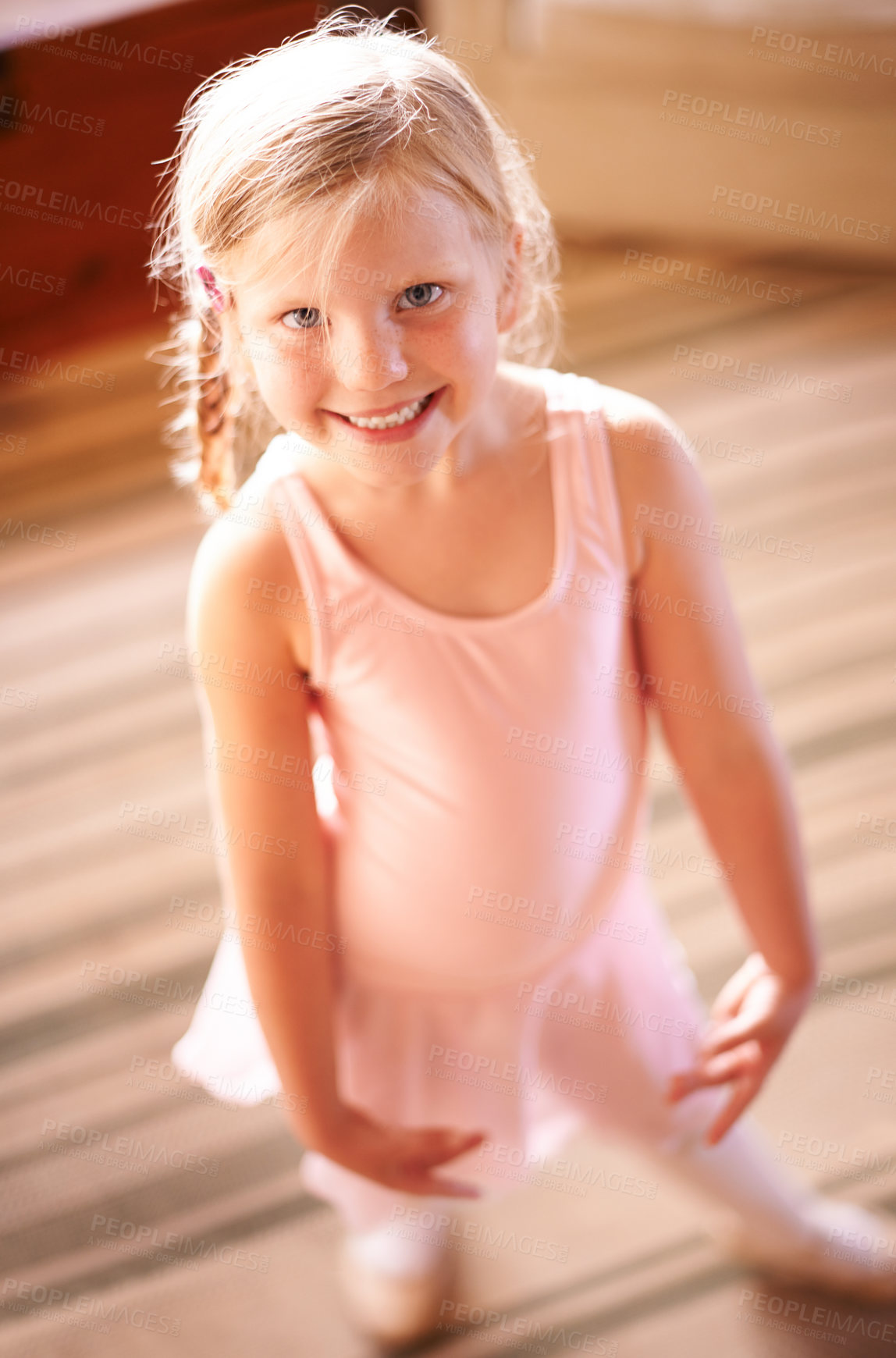 Buy stock photo Kid, portrait and ballet tutu for dance, confidence and skill in living room for growth or fun in home. Girl, above and smile with dancer, practice or development for creative in house lounge