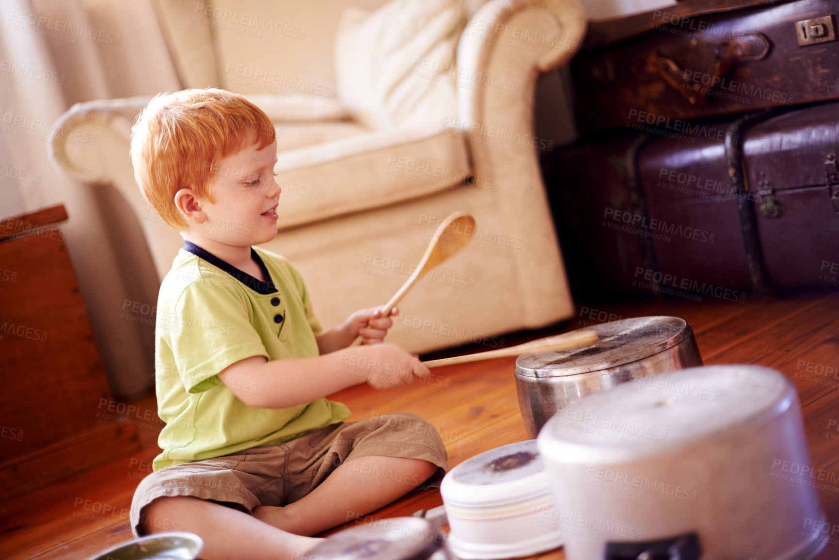 Buy stock photo House, drum and boy with pots, pans and playful with happiness, noise and activity. Child, apartment and kid in living room, wooden spoons and cheerful with music, energy or hyperactive with game