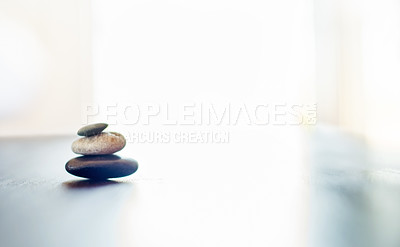 Buy stock photo Rock, pile and mockup space with zen for therapy, calm tranquility or relaxation at beauty spa or luxury salon. Stones, stack and peace with light background for clean serenity, health and wellness