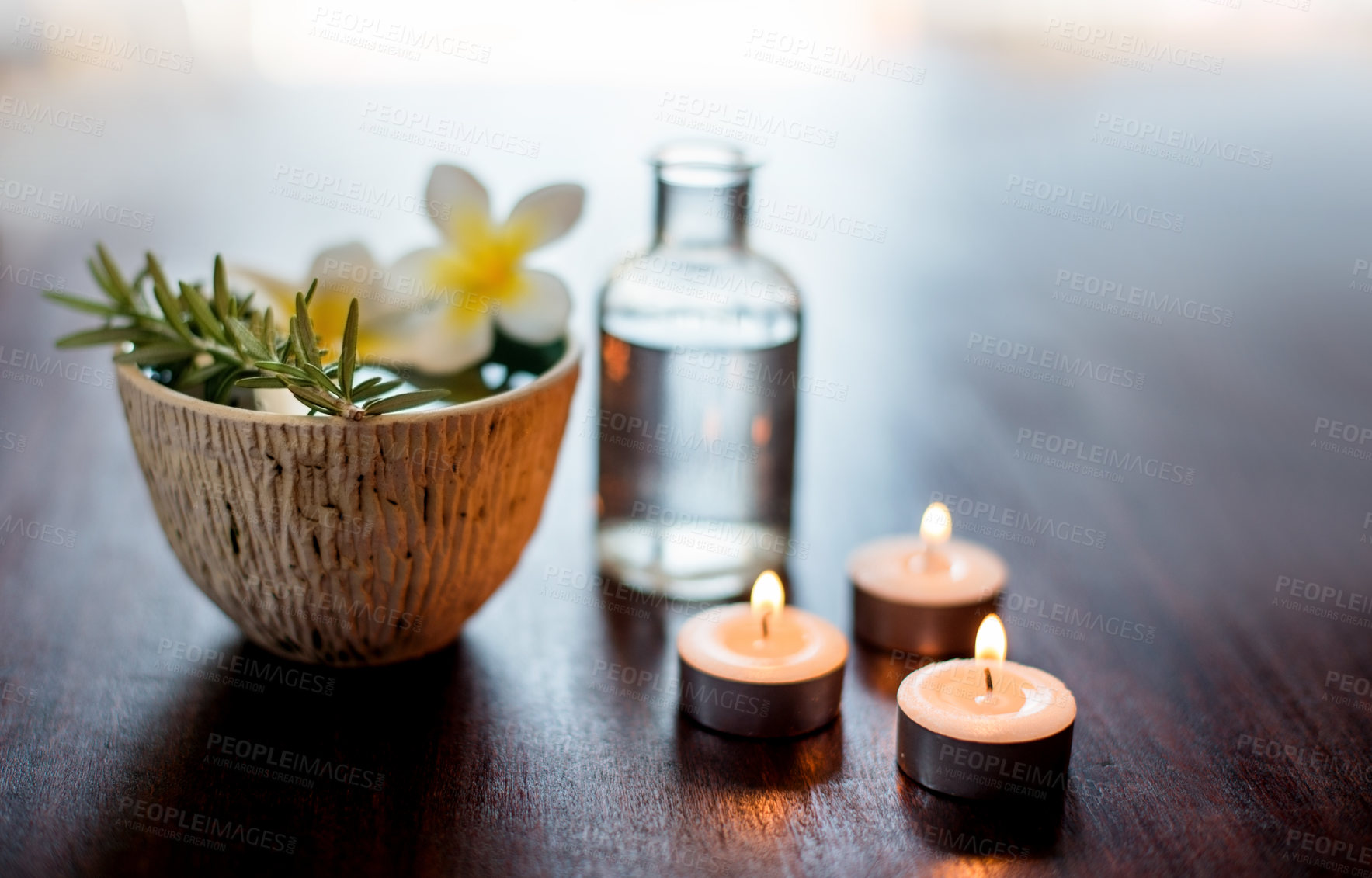 Buy stock photo Flower, candles and rosemary in spa for aromatherapy, wellness and treatment with herbs. Salon aesthetic, holistic service and essential oil for cosmetics, beauty and health for calm or peace