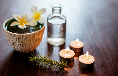 Buy stock photo Flowers, candles and bowl of water in spa for self care, wellness and beauty treatment. Salon aesthetic, holistic and rosemary herbs for cosmetics, aromatherapy and health for zen, calm and peace