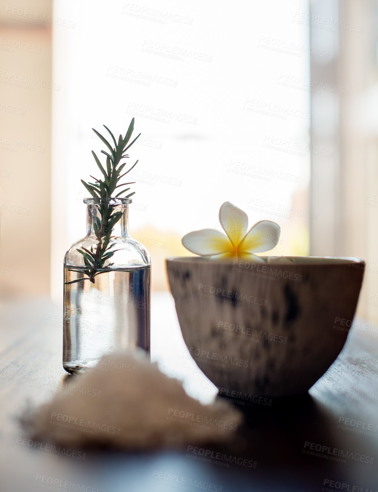 Buy stock photo Flowers, rosemary and bowl in spa for beauty, wellness and treatment. Salon aesthetic, holistic service and jar with salt and herbs for cosmetics, aromatherapy and health for zen, calm and peace