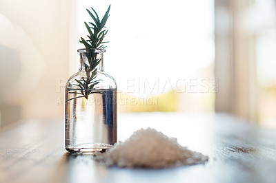 Buy stock photo Water, rosemary and bath salt in bathroom for beauty, wellness and skincare treatment. Spa aesthetic, dermatology and jar with herbs for cosmetics, aromatherapy and health for zen, calm and peace