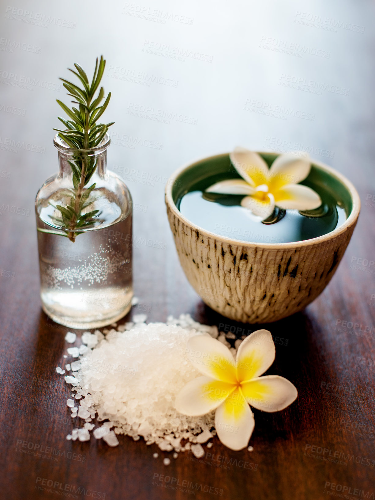 Buy stock photo Flowers, rosemary and bath salt in spa for beauty, wellness and skincare treatment. Salon aesthetic, dermatology and jar with herbs for cosmetics, aromatherapy and health for zen, calm and peace